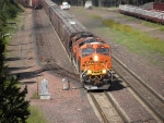 An eastbound grain train approaches the footbridge in Essex. 